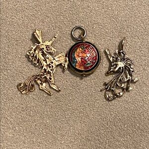 Three Unicorn charms.
Circa 1980s